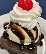 Image of brownie topped with ice cream at a funeral reception